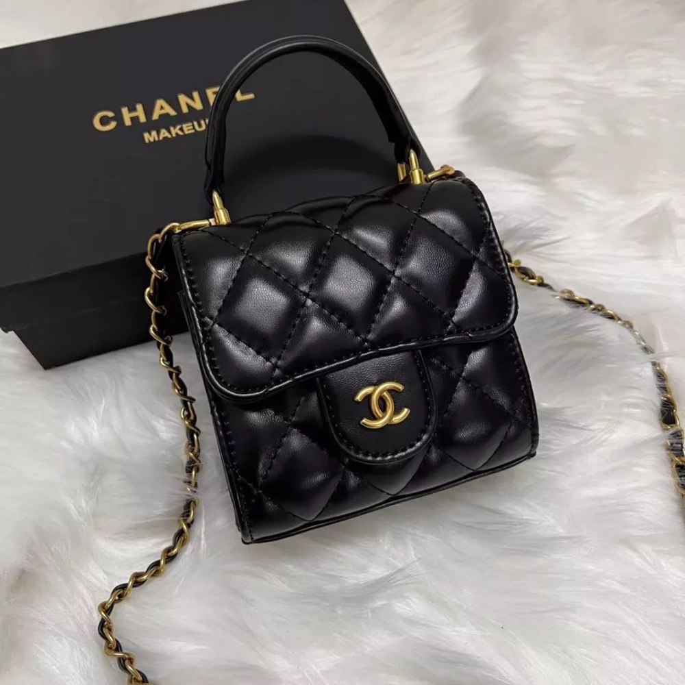 Mini Chanel Black Quilted Leather Bag - new with box and tag. iPhone doesn’t fit